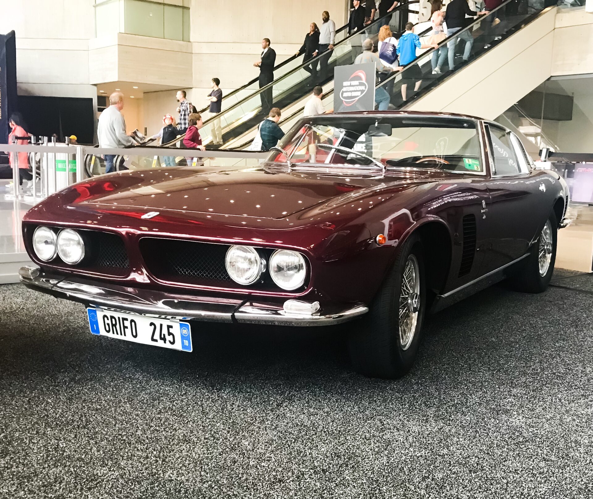 Maroon Iso Grifo on the show floor of an auto exhibition