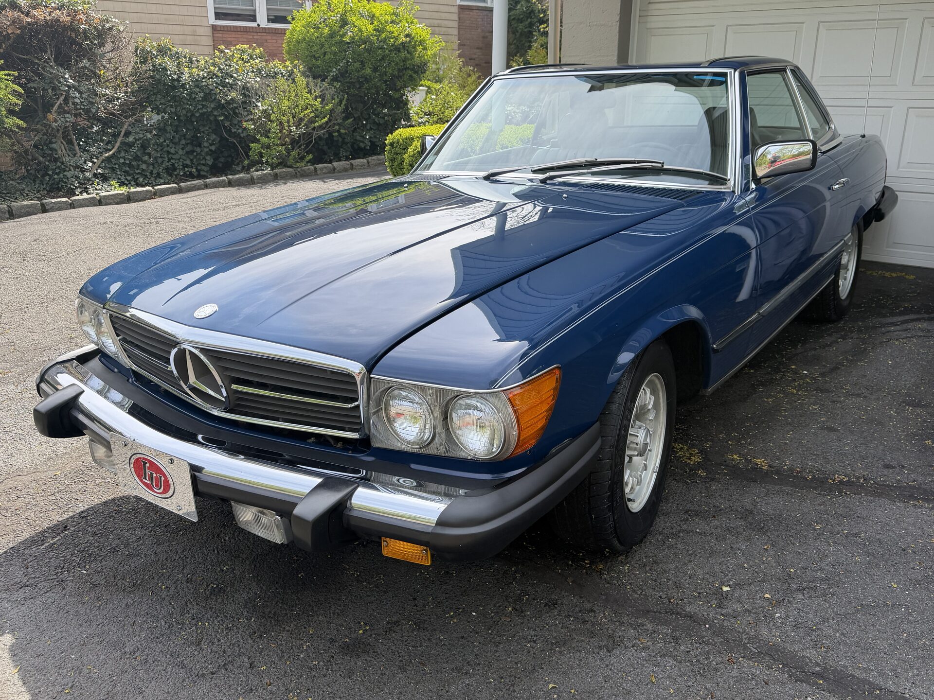 Dark blue Mercedes-Benz 450SL with hardtop, parked in a driveway