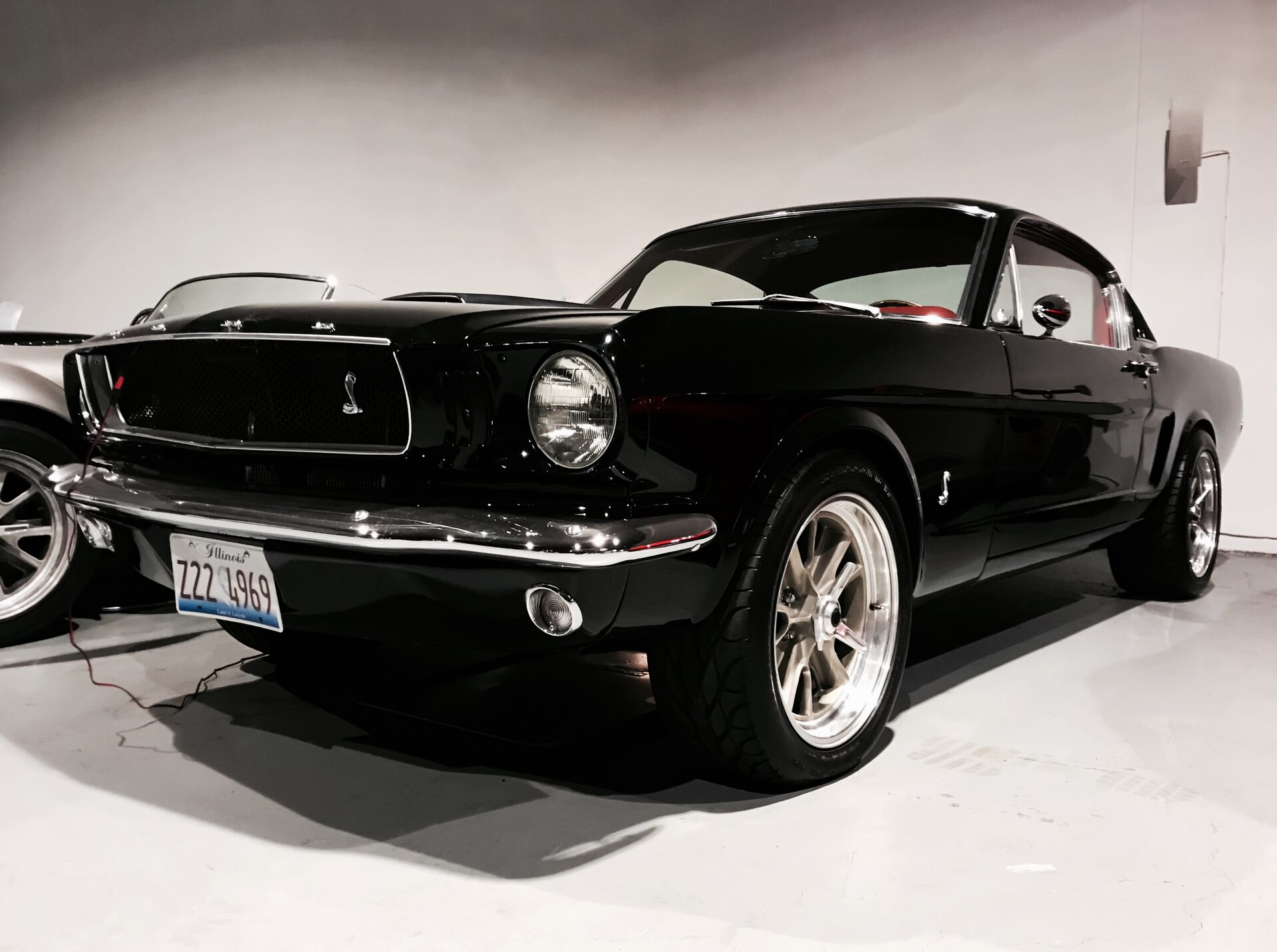 Black 1968 Ford Mustang fastback, side profile