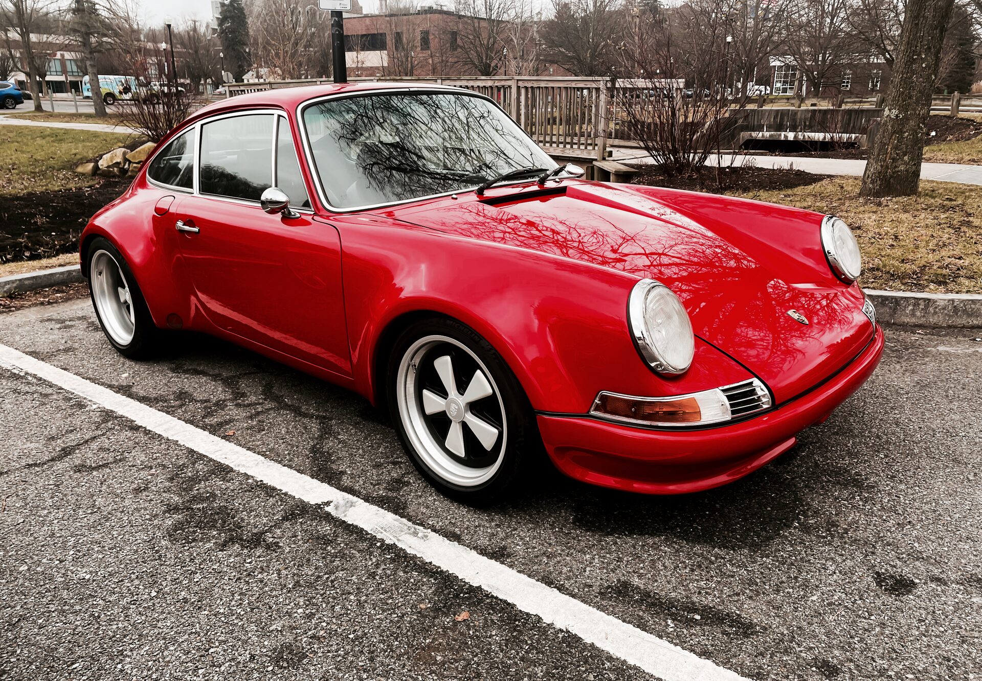 Porsche 911 in classic silver, three-quarter view