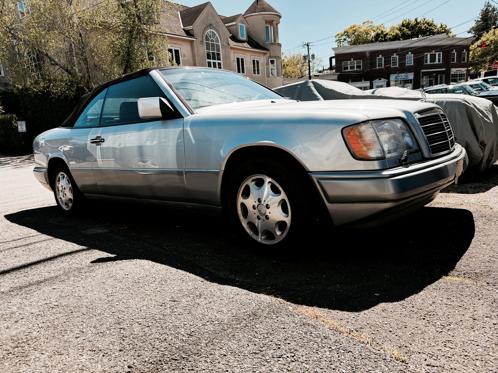 Silver 1995 Mercedes-Benz E320 Cabriolet, front three-quarter right view with the soft top up