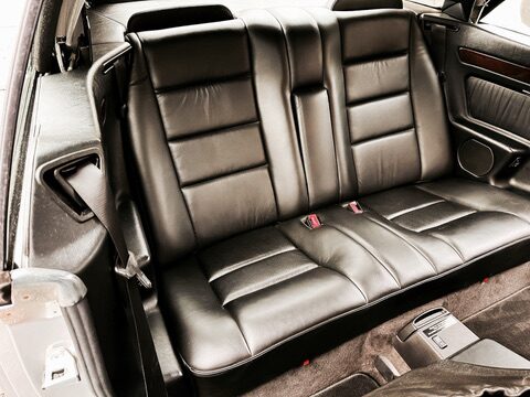Close-up of the rear leather bench seat in the 1995 Mercedes E320 Cabriolet