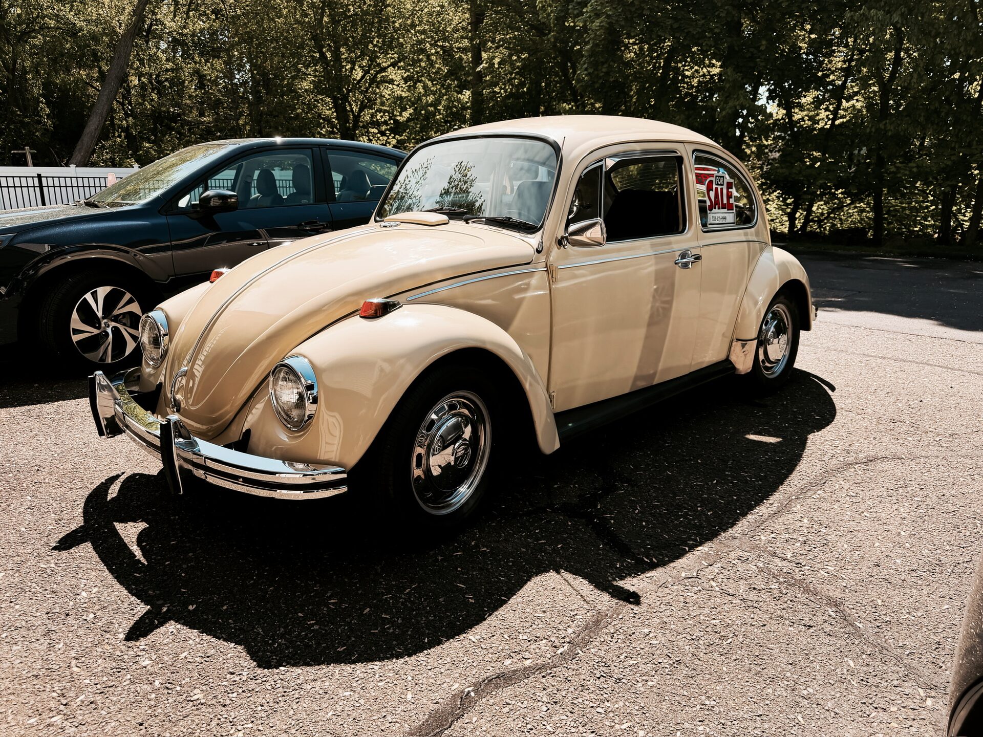 Cream 1969 VW Beetle, front three-quarter left view with For Sale sign in the window
